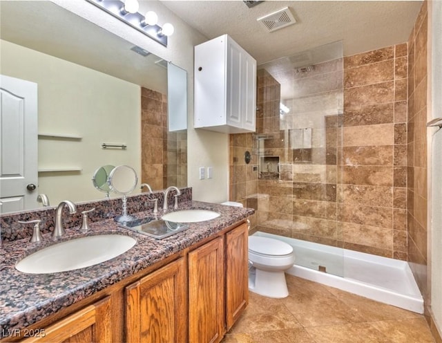 7751 Locke Haven Dr, Las Vegas, NV 89123 - bathroom with walk in shower, toilet, double vanity, and tile patterned flooring