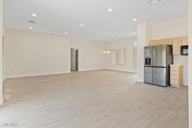 unfurnished living room featuring recessed lighting, baseboards, visible vents, and light wood-style floors