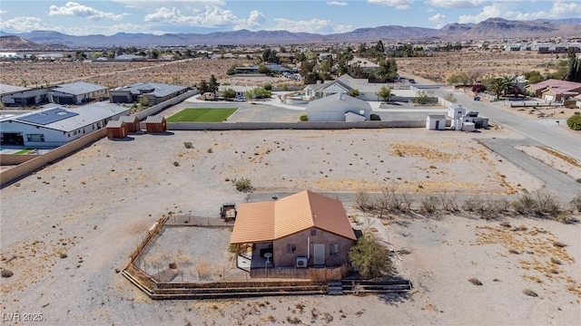 bird's eye view featuring a residential view, view of desert, and a mountain view