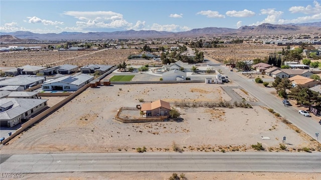 bird's eye view featuring a residential view, a mountain view, and a desert view