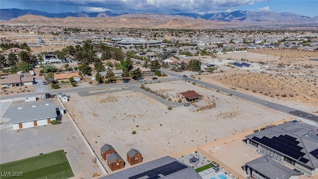 aerial view with a residential view, view of desert, and a mountain view