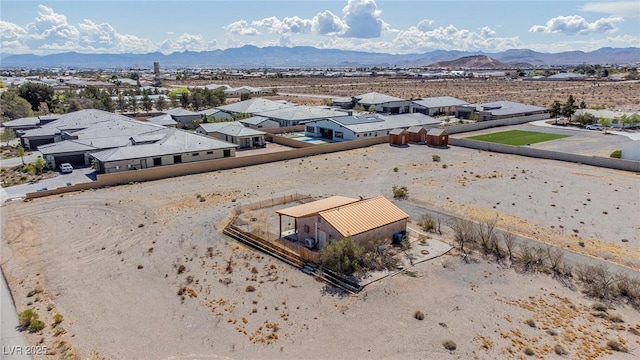 bird's eye view featuring a residential view, view of desert, and a mountain view