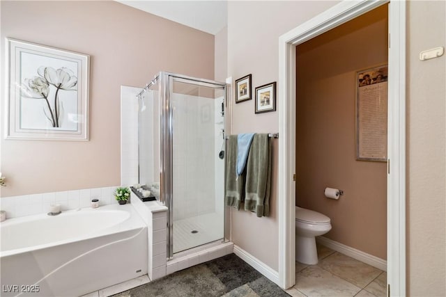 bathroom with a shower stall, tile patterned floors, a garden tub, and toilet