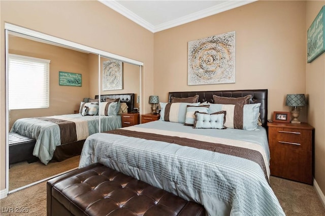 bedroom with baseboards, ornamental molding, a closet, and carpet floors