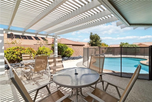 view of swimming pool with a pergola, outdoor dining area, and a fenced backyard