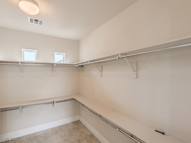 walk in closet featuring visible vents
