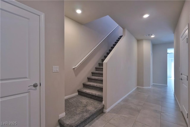 staircase with baseboards, recessed lighting, and visible vents