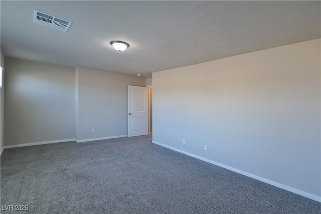 carpeted spare room with baseboards and visible vents
