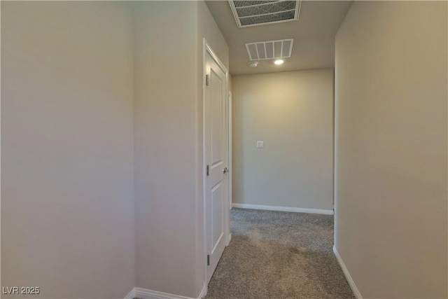 hall featuring recessed lighting, baseboards, visible vents, and carpet