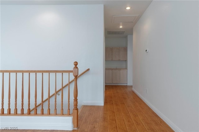 787 Craigmark Ct, Henderson, NV 89002 - hall with an upstairs landing, wood finished floors, recessed lighting, baseboards, and attic access