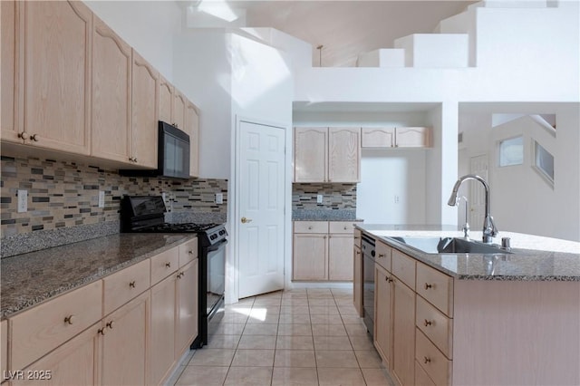 787 Craigmark Ct, Henderson, NV 89002 - kitchen with black appliances, a sink, a towering ceiling, light stone counters, and tasteful backsplash