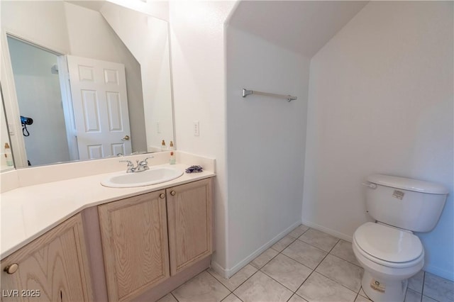 787 Craigmark Ct, Henderson, NV 89002 - bathroom with toilet, vanity, tile patterned flooring, and baseboards
