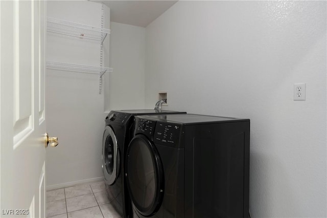 787 Craigmark Ct, Henderson, NV 89002 - laundry area with independent washer and dryer, light tile patterned floors, and baseboards
