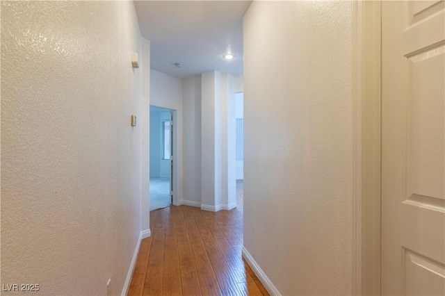 787 Craigmark Ct, Henderson, NV 89002 - hall with hardwood / wood-style floors, baseboards, a textured wall, and recessed lighting