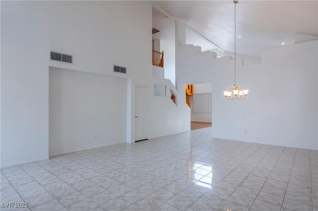 787 Craigmark Ct, Henderson, NV 89002 - empty room with a high ceiling, a chandelier, tile patterned floors, and stairway