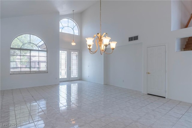787 Craigmark Ct, Henderson, NV 89002 - spare room with high vaulted ceiling, a chandelier, and light tile patterned floors