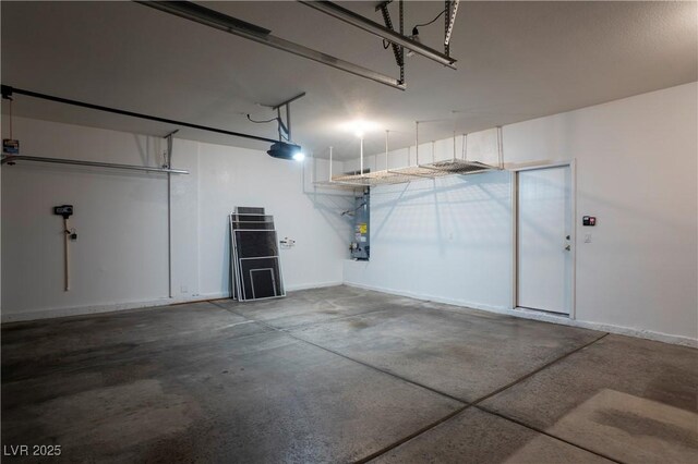 787 Craigmark Ct, Henderson, NV 89002 - garage with a garage door opener, gas water heater, and baseboards