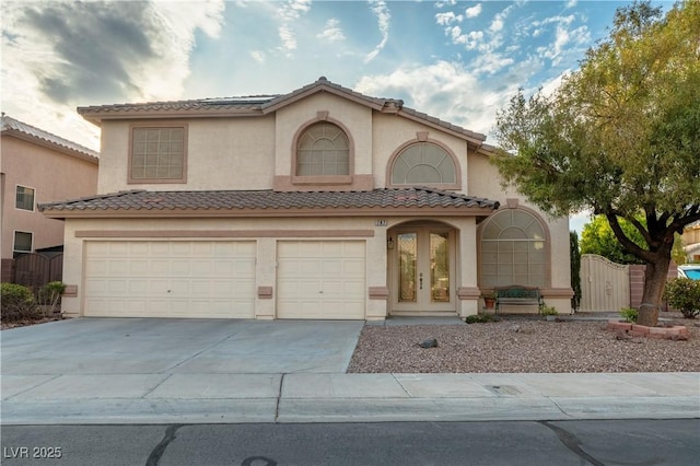 787 Craigmark Ct, Henderson, NV 89002 - mediterranean / spanish home featuring concrete driveway, stucco siding, an attached garage, and a tiled roof