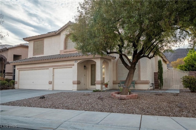 787 Craigmark Ct, Henderson, NV 89002 - view of front of house featuring stucco siding, concrete driveway, a gate, and a garage