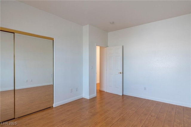 787 Craigmark Ct, Henderson, NV 89002 - unfurnished bedroom with light wood-type flooring, baseboards, and a closet