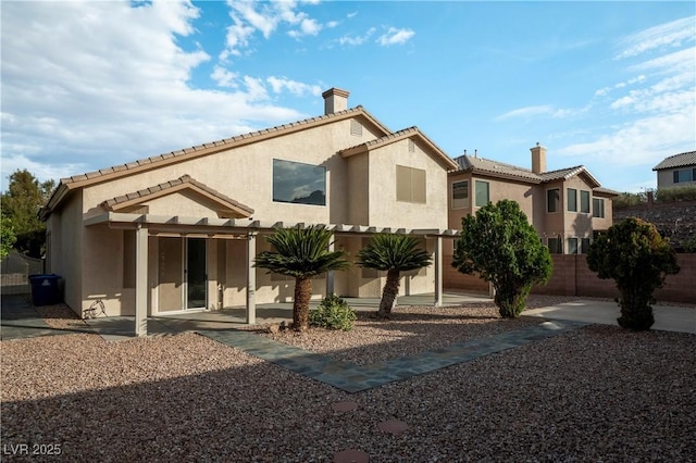 787 Craigmark Ct, Henderson, NV 89002 - rear view of property featuring a chimney, stucco siding, and a tile roof