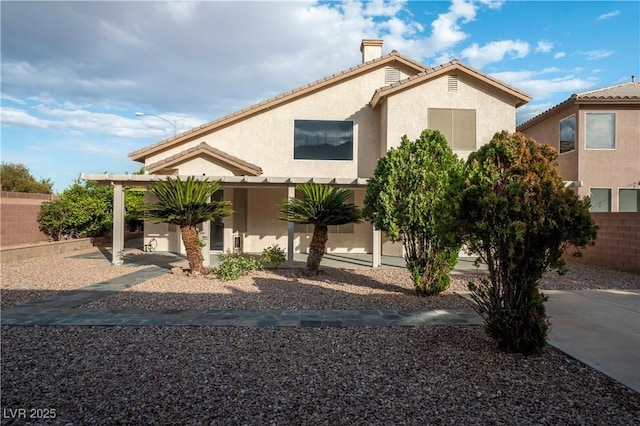787 Craigmark Ct, Henderson, NV 89002 - view of front facade with stucco siding, a chimney, and a tile roof