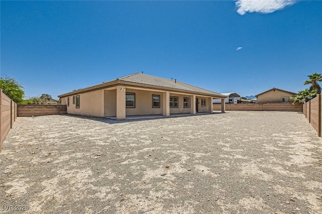 3910 Internet Ave, North Las Vegas, NV 89031 - back of property featuring a fenced backyard and stucco siding
