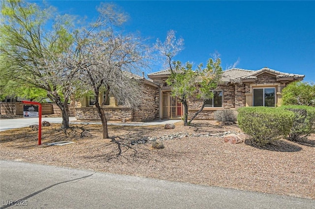 3910 Internet Ave, North Las Vegas, NV 89031 - view of front of home featuring a tiled roof and stone siding
