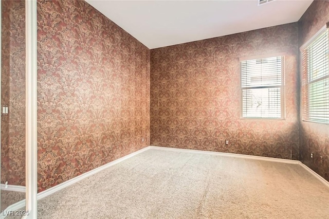3910 Internet Ave, North Las Vegas, NV 89031 - carpeted empty room featuring healthy amount of natural light and baseboards
