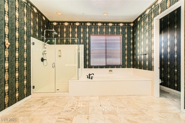 3910 Internet Ave, North Las Vegas, NV 89031 - bathroom featuring wallpapered walls, a shower stall, a bath, toilet, and baseboards