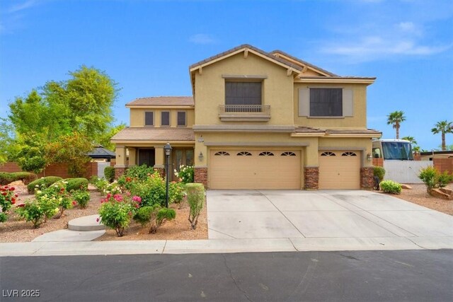 6335 Iginlas Goal Ave, Las Vegas, NV 89131 - traditional-style home with an attached garage, stucco siding, driveway, and fence