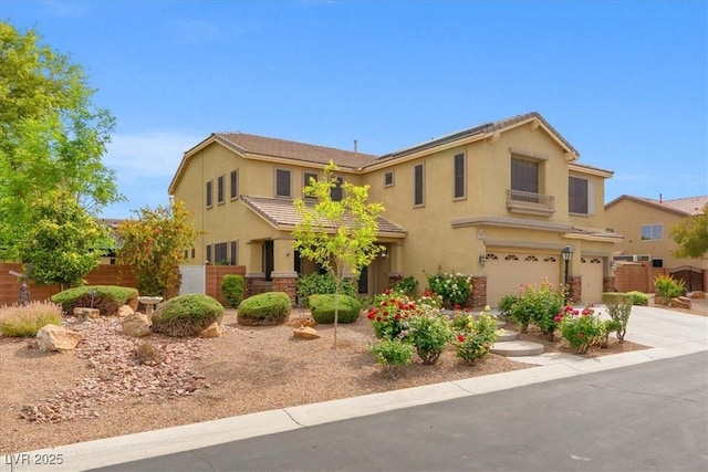 6335 Iginlas Goal Ave, Las Vegas, NV 89131 - traditional-style house featuring stucco siding, a garage, fence, and concrete driveway