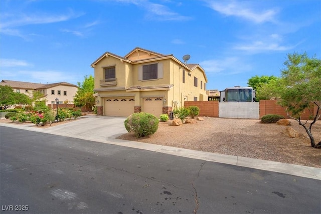 6335 Iginlas Goal Ave, Las Vegas, NV 89131 - traditional-style house with concrete driveway, an attached garage, fence, and stucco siding