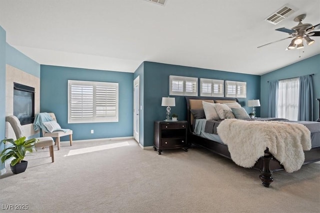6335 Iginlas Goal Ave, Las Vegas, NV 89131 - bedroom with carpet flooring, ceiling fan, baseboards, vaulted ceiling, and visible vents
