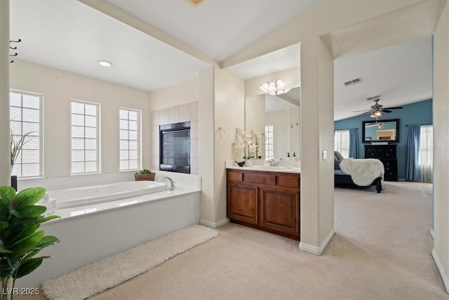 6335 Iginlas Goal Ave, Las Vegas, NV 89131 - ensuite bathroom featuring connected bathroom, vanity, carpet floors, visible vents, and a garden tub