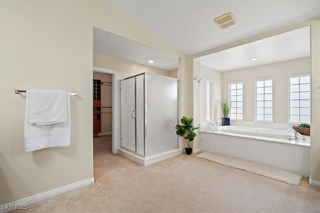 6335 Iginlas Goal Ave, Las Vegas, NV 89131 - bathroom with baseboards, carpet, a stall shower, and a garden tub