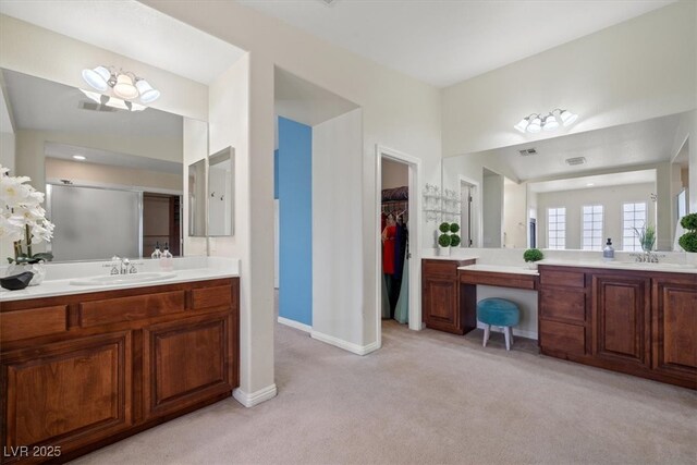 6335 Iginlas Goal Ave, Las Vegas, NV 89131 - full bath featuring carpet floors, baseboards, two vanities, and a sink