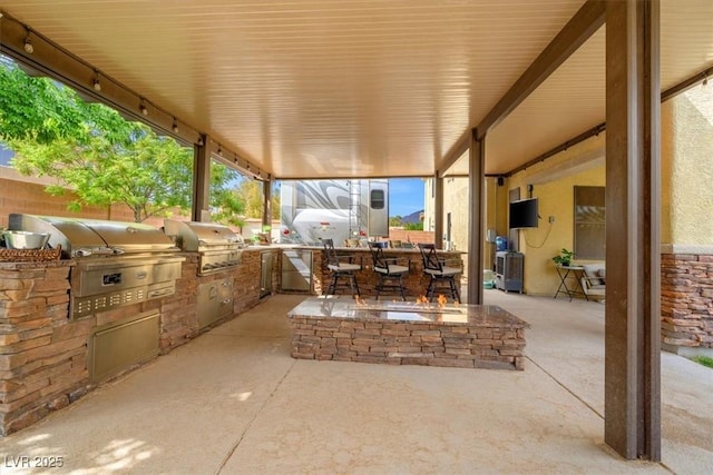6335 Iginlas Goal Ave, Las Vegas, NV 89131 - view of patio featuring exterior kitchen and a grill