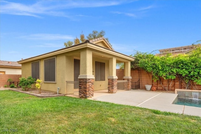 6335 Iginlas Goal Ave, Las Vegas, NV 89131 - back of property with stone siding, stucco siding, a fenced in pool, a lawn, and fence private yard