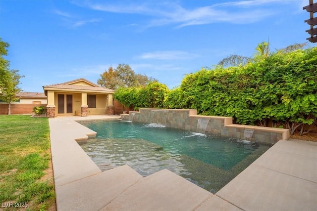 6335 Iginlas Goal Ave, Las Vegas, NV 89131 - view of swimming pool featuring fence, a fenced in pool, a patio area, a lawn, and an outdoor structure