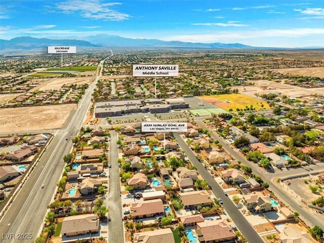 6335 Iginlas Goal Ave, Las Vegas, NV 89131 - drone / aerial view with a residential view and a mountain view