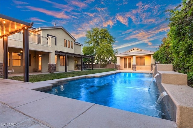 6335 Iginlas Goal Ave, Las Vegas, NV 89131 - pool at dusk featuring a patio, an outbuilding, and an outdoor pool