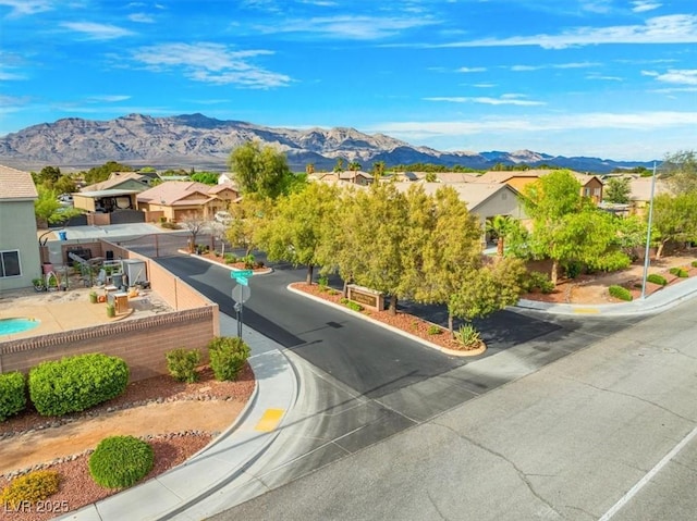 6335 Iginlas Goal Ave, Las Vegas, NV 89131 - view of road featuring a residential view, a mountain view, and curbs
