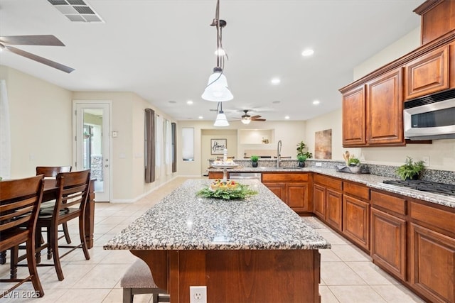 6335 Iginlas Goal Ave, Las Vegas, NV 89131 - kitchen with a sink, ceiling fan, appliances with stainless steel finishes, and light tile patterned floors