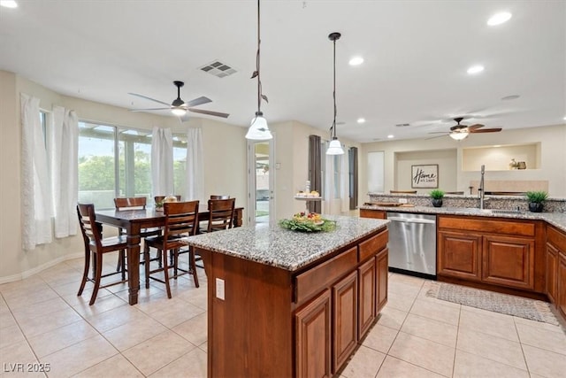 6335 Iginlas Goal Ave, Las Vegas, NV 89131 - kitchen with stainless steel dishwasher, ceiling fan, visible vents, and a sink