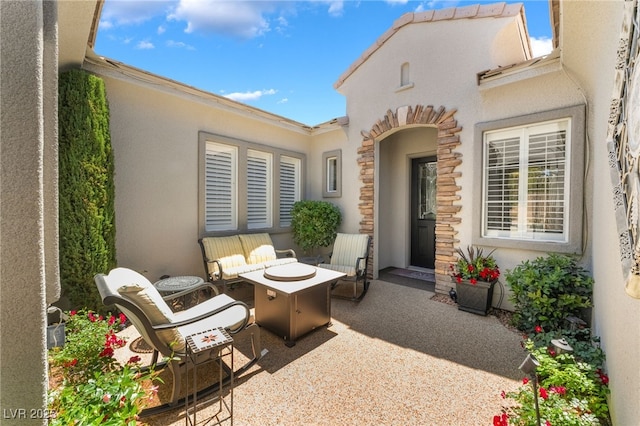 view of patio / terrace with a fire pit