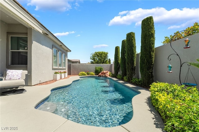 view of swimming pool featuring a fenced backyard and a fenced in pool
