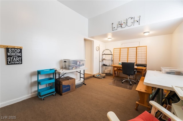 carpeted home office with baseboards