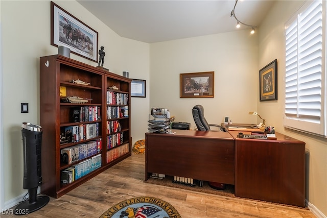 office space with wood finished floors