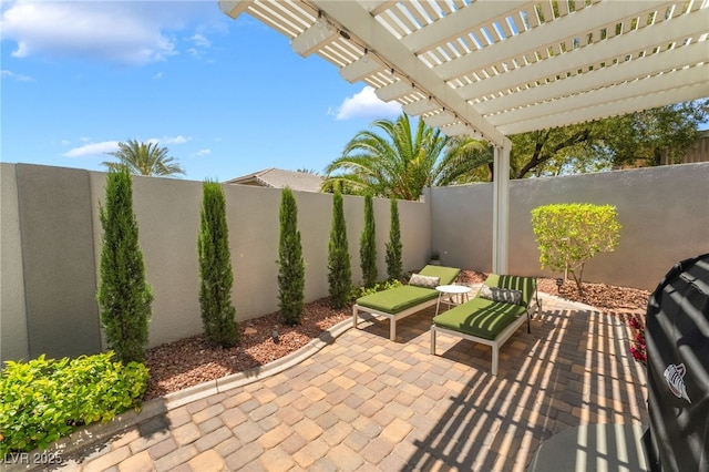 view of patio / terrace with a pergola and a fenced backyard